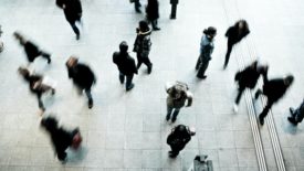 blurred image of people walking